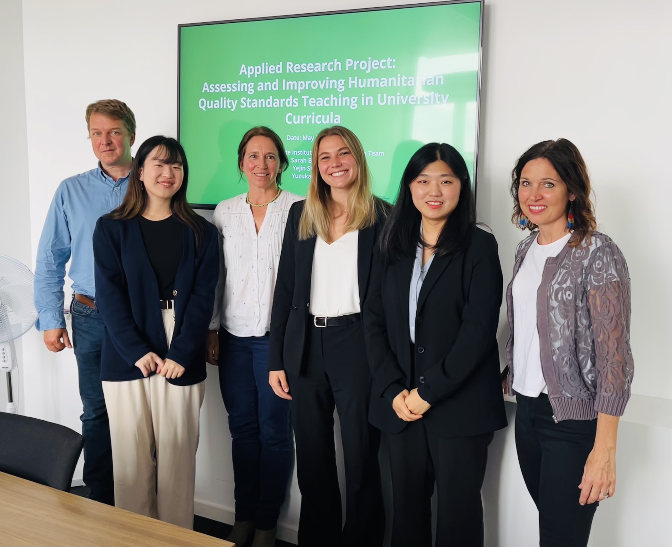 IHEID students with their supervisor and Sphere staff members