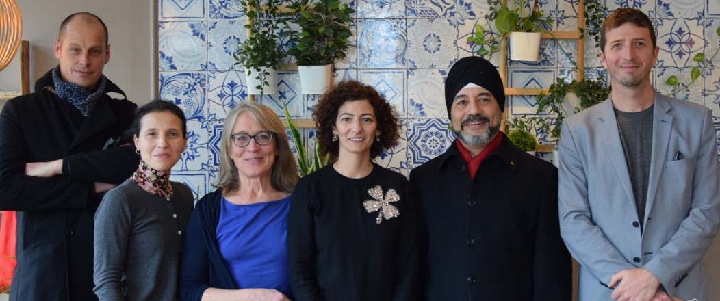 Photo of five members of the Sphere team with new president, Rita Rhayem
